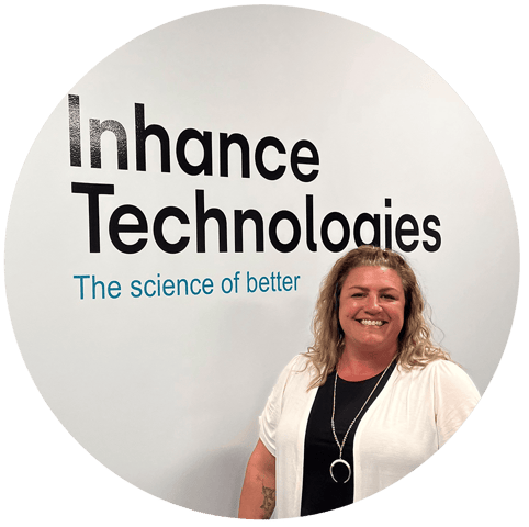 woman in front of inhance technologies logo